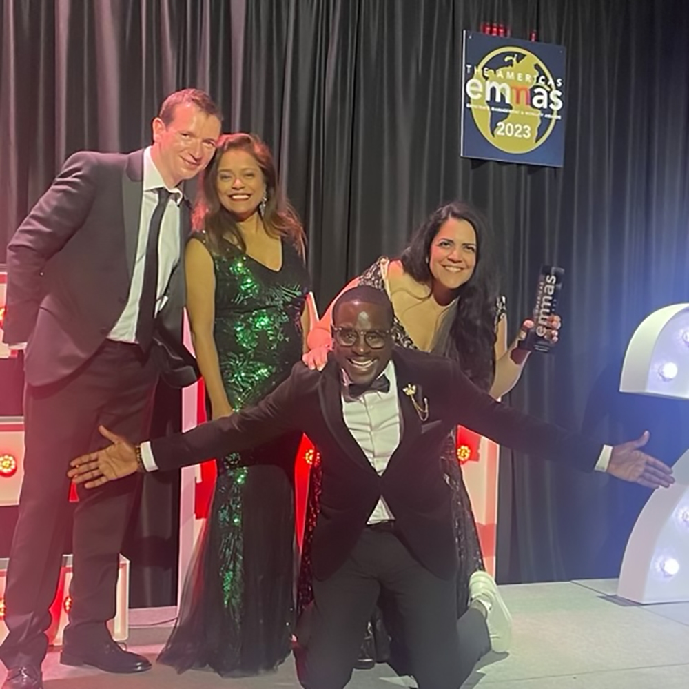 Celebrating Immigration Provider of the Year at the 2023 EMMAs with Ian Robinson, Tahira Pandit, Derek Quashie, and Sheila Snyder